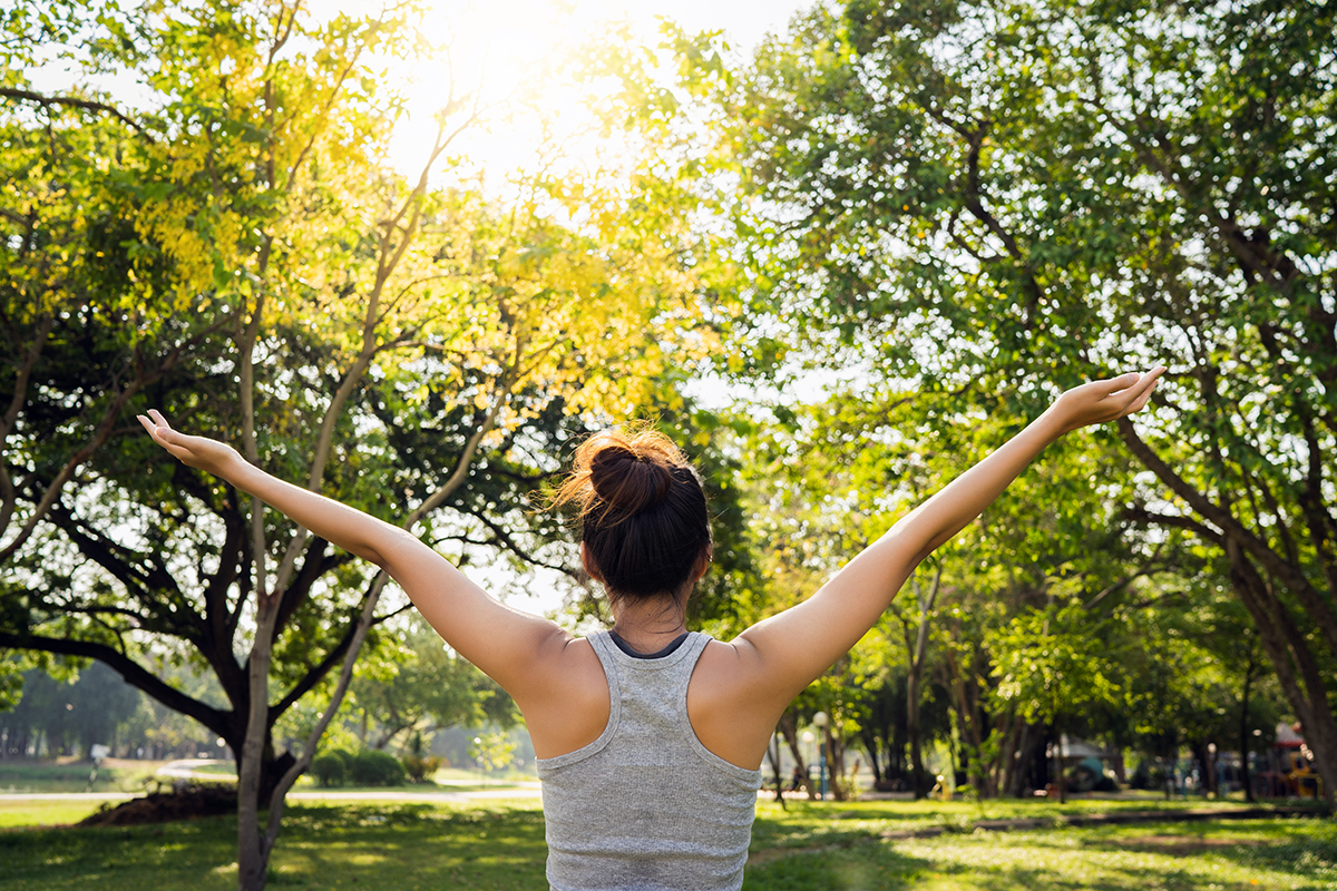 Healthy young Asian runner woman warm up the body stretching bef